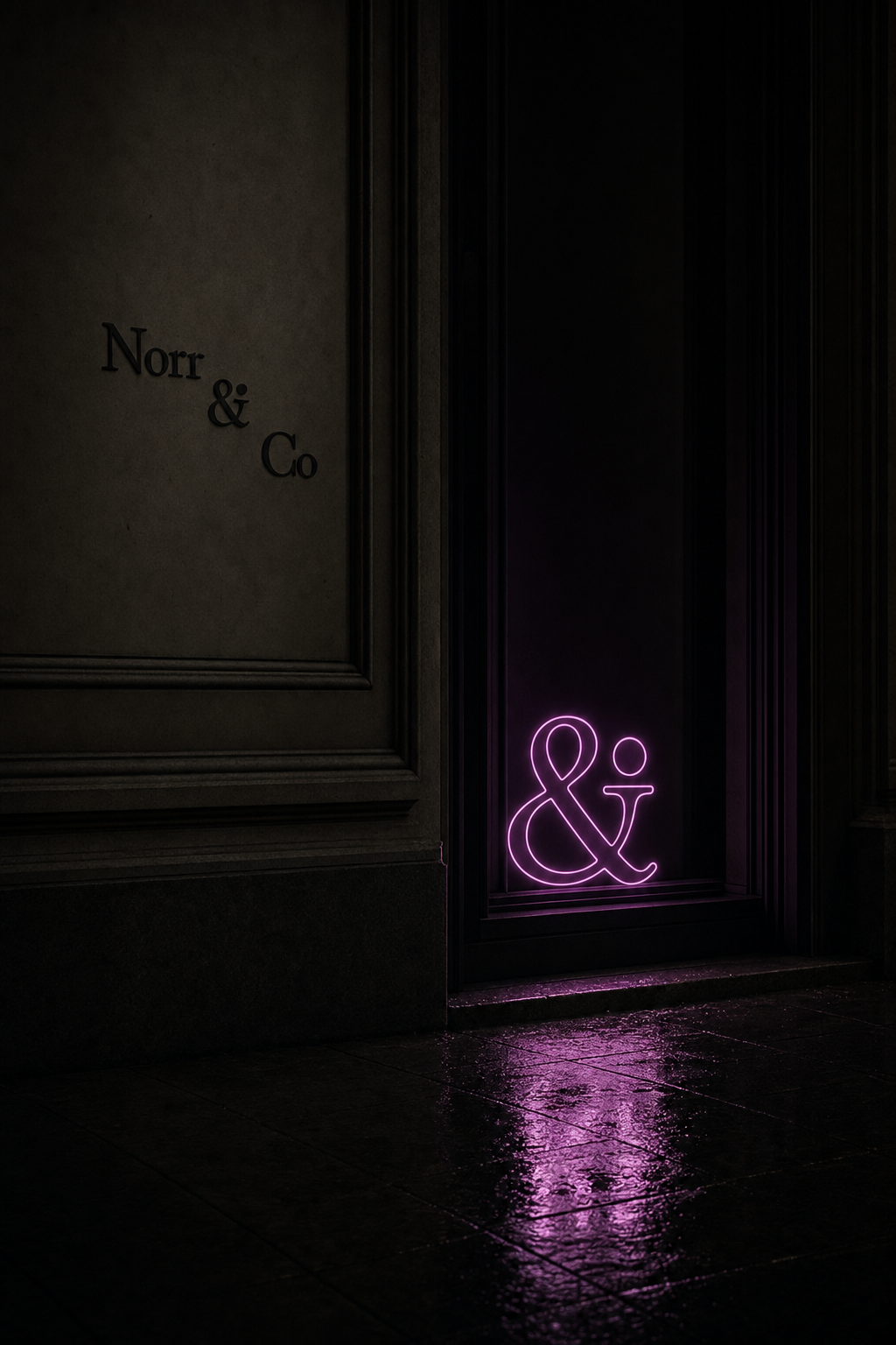 Low Key neon ampersand reflected on a dark pavement